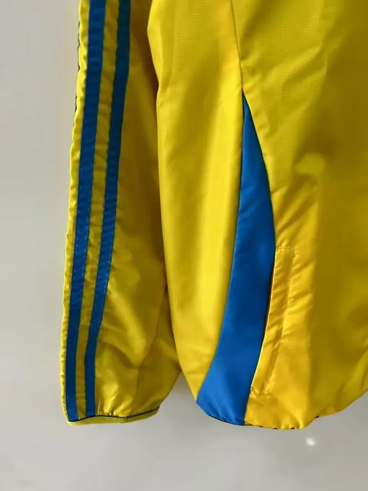 2025/2026 Barcelona Chaqueta Cortavientos Reversible amarilla y azul Camiseta de Fútbol Calidad Tailandesa